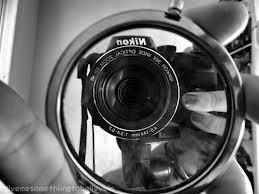 black and white mirror reflection Nikon camera close-up 