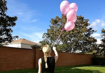 five pink balloons