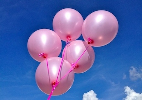 five pink balloons