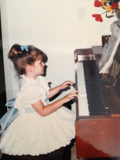 playing piano at four