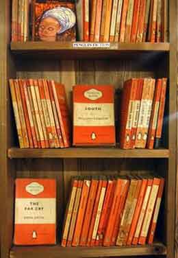 Bookshelf Full of Similar Looking Books Showing Design Principle of Unity