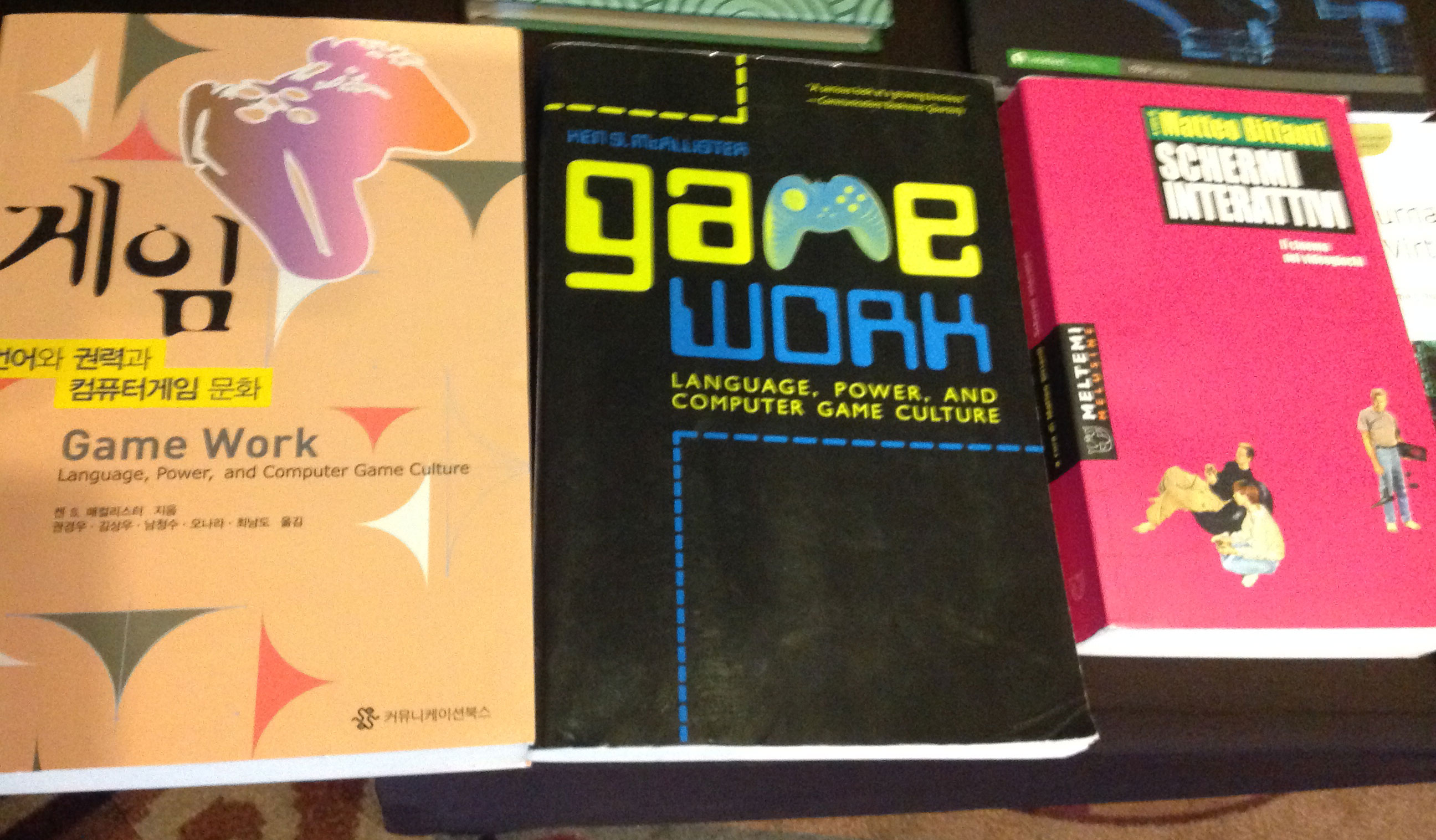 Books at the book table, including Game Work