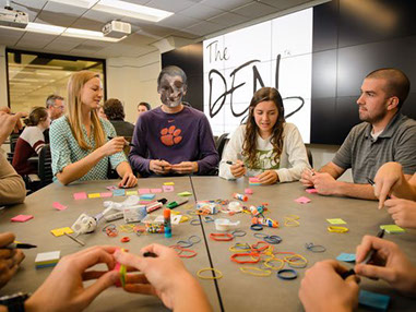 students playing a game, one of whom appears to be a ghost