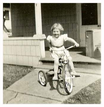 Barb riding a tricycle