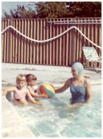 Olive in a swimming pool with children