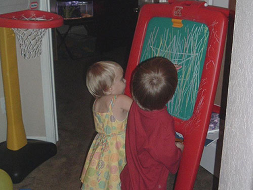 Rowan and Henry drawing together.