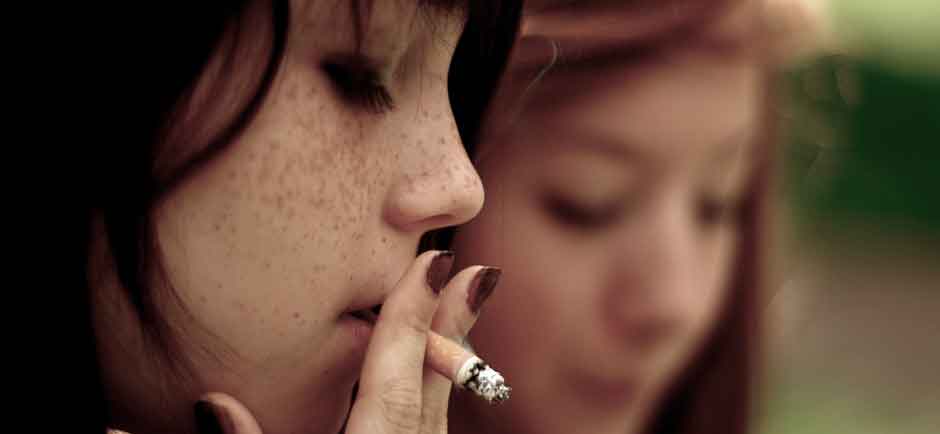 image of teenage girl smoking