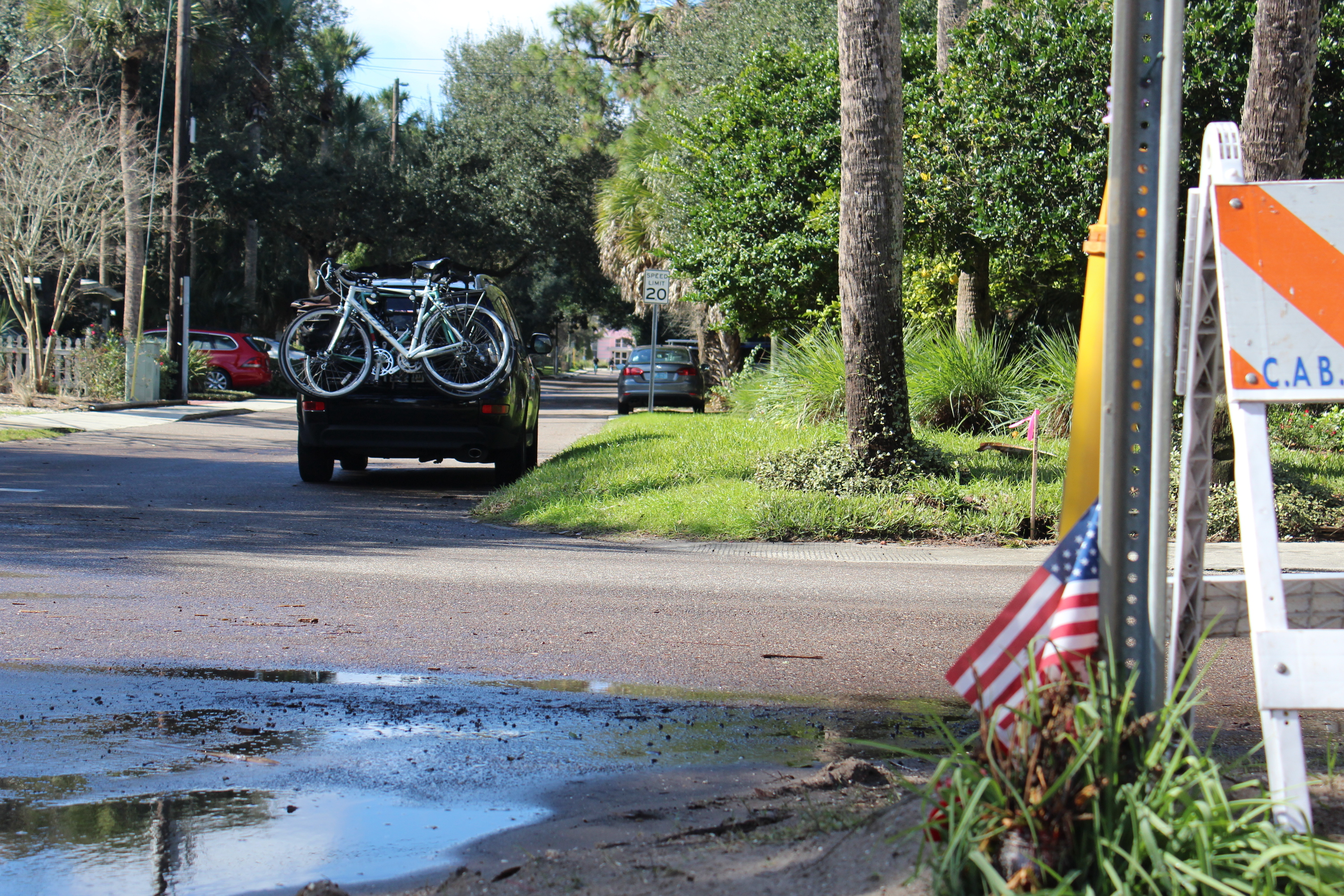 background image, Florida street scene with bikes on the back of a parked van