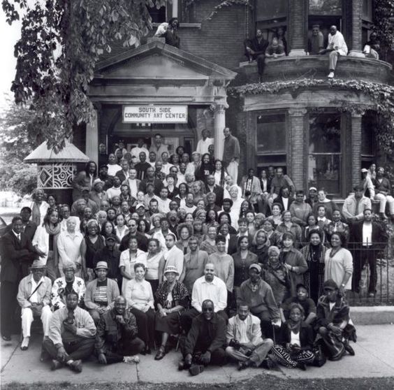 Members of Bronzeville Art Center/ South Side Community Center assembled for a photgraph on the steps, street, and wondows of the historical building. Courtesy Bronzeville Pinterest page: https://www.pinterest.com/pin/102738435219819822/