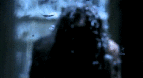 An animated gif from Night Watch featuring a subtitle that is covered by falling feathers. The subtitle sticks to the speaker as the camera moves away from her. The subtitle: 'Don't look at me!'