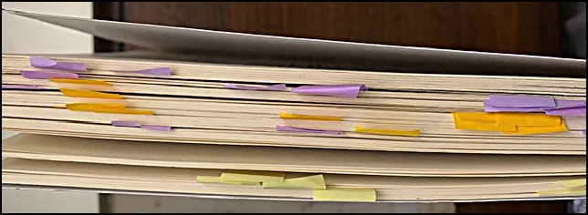 Book pages shown with different colored tabs sticking out.