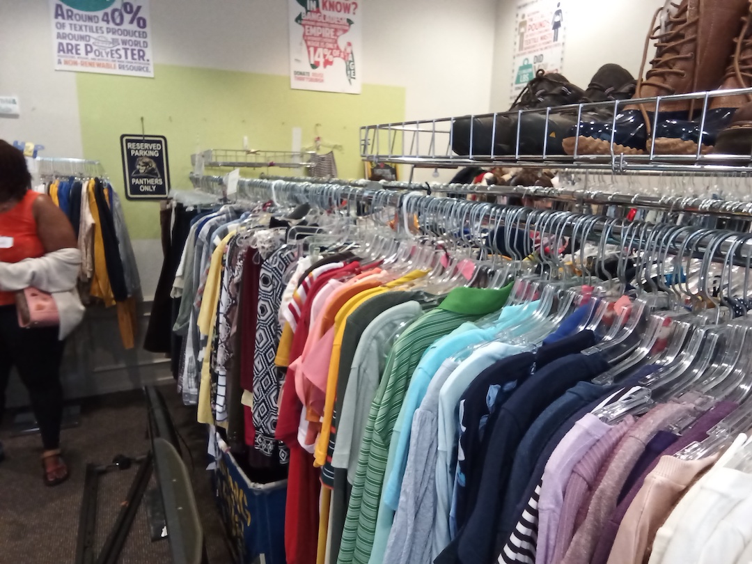 rack of shirts in thrift store on University of Pittsburgh's campus.