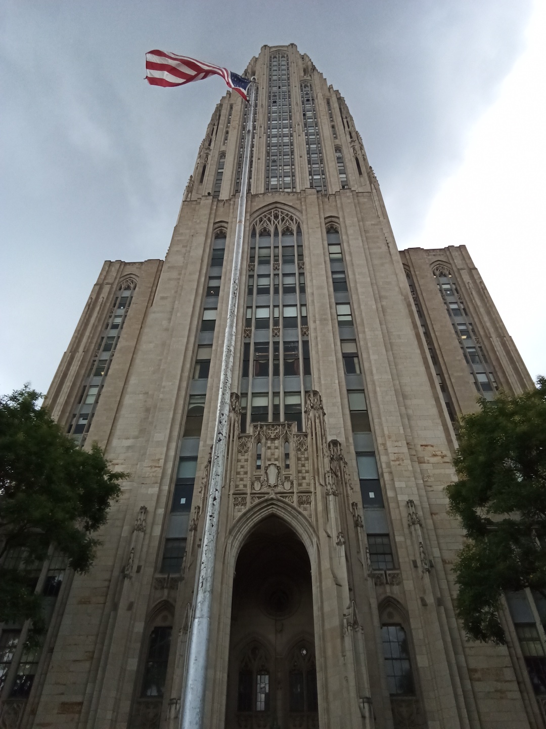Low-angle shot of the The Cathedral of Learning, an educational building at Pitt.