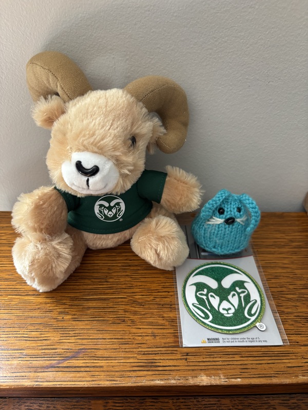 CC with a plush ram and magnet that bear the Colorado State University logo.