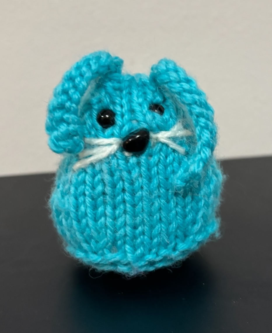 A blue knitted bunny.