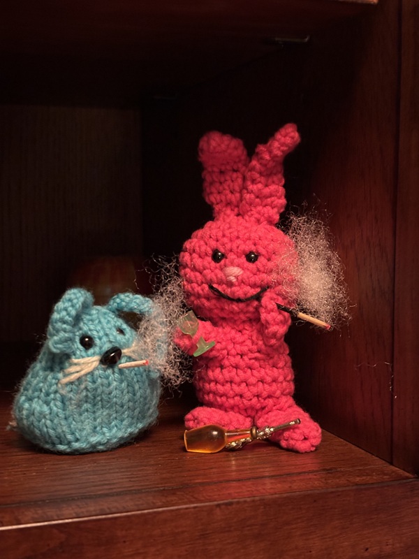 Evil Bunny and CC are still standing together, but CC now has her own cigarette and is smoking with Evil Bunny.